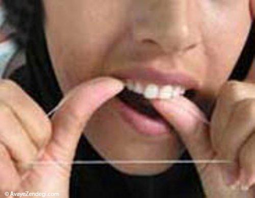 آموزش استفاده صحیح از نخ دندان 